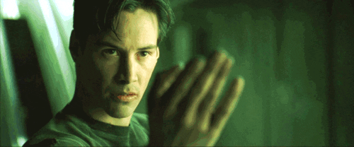 Keanu Reeves qui agite la main film matrix